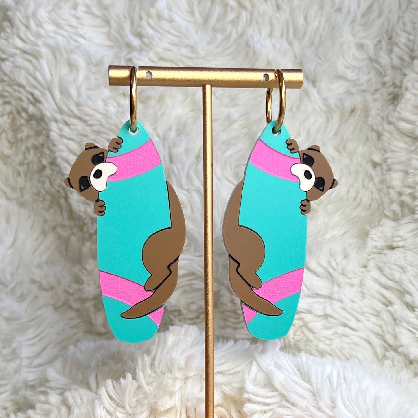 Mischievous otter earrings