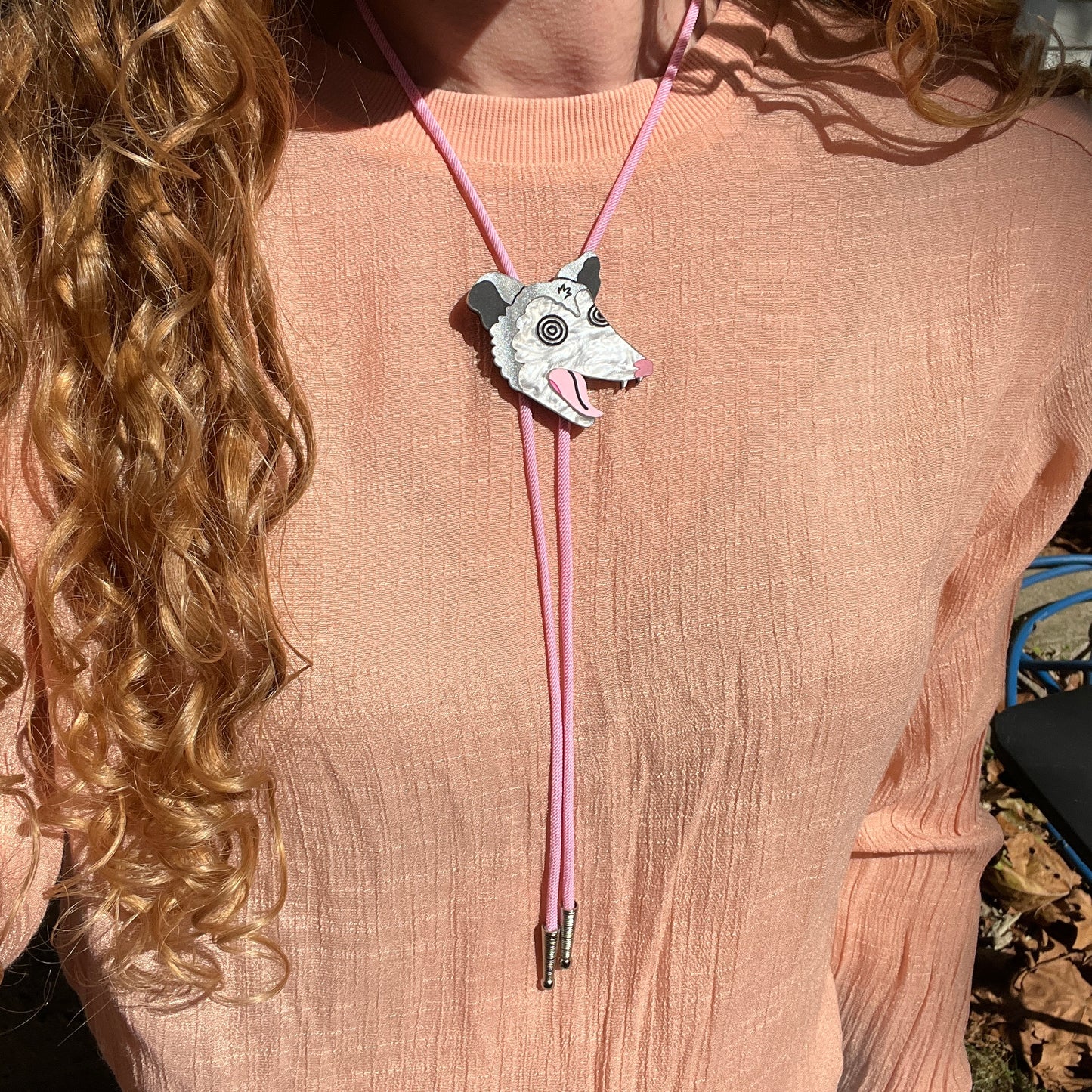 Unhinged opossum bolo tie
