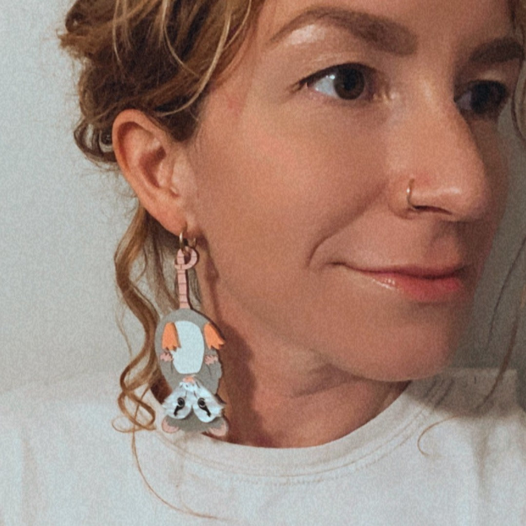 Hanging opossum earrings